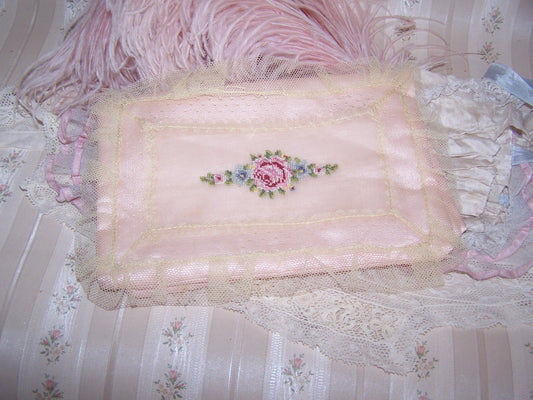 Small Art Deco hanky holder of pale pink satin covered with a lace overlay and then hand embroidered with a single pink rose and blue forget-me-nots.