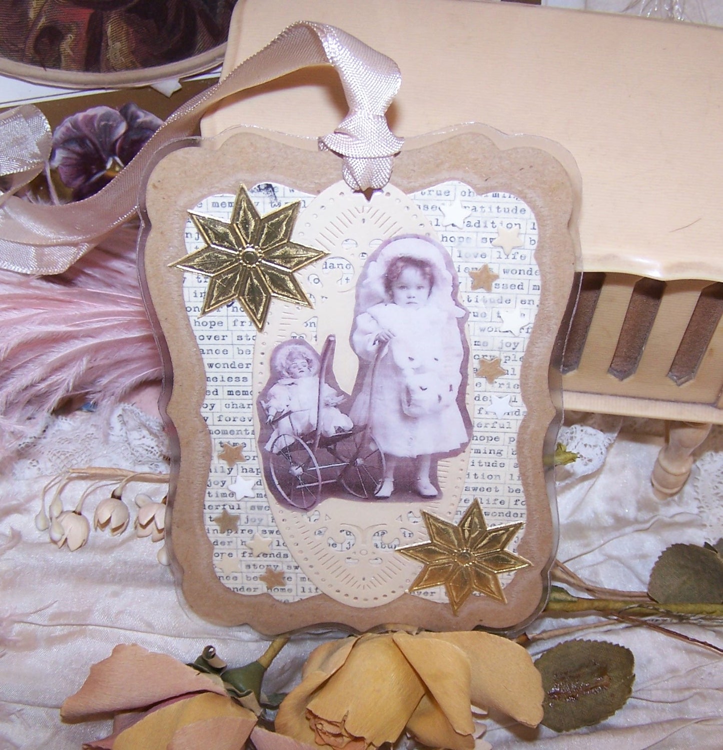 Merry Christmas. Re-useable gift tag / card made from mixed materials. Modern day cardstock with repro antique images - a little girl and her porcelain doll.