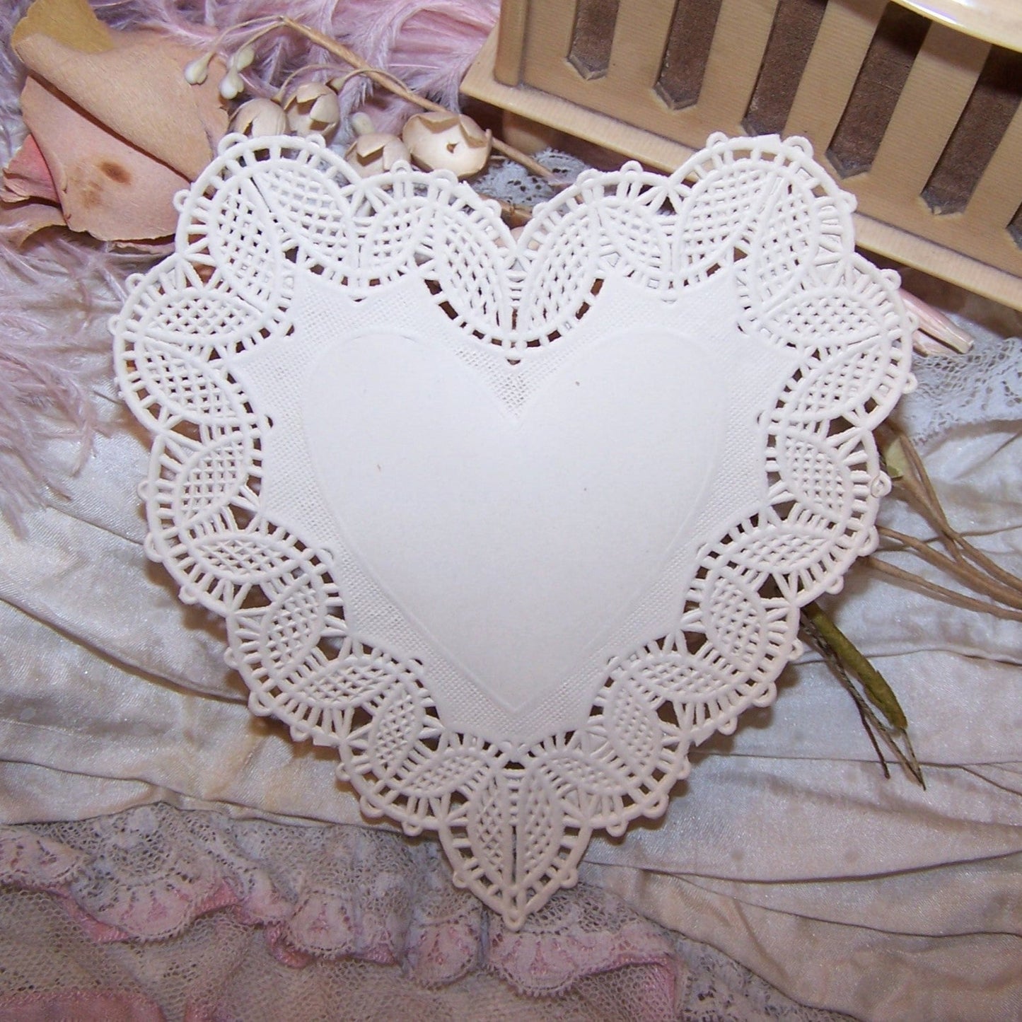 One single sheet of GENUINE Antique Victorian paper lace used to make Valentines. A lovely medium-sized heart measuring 4" x 4-1/4". Excellent condition.