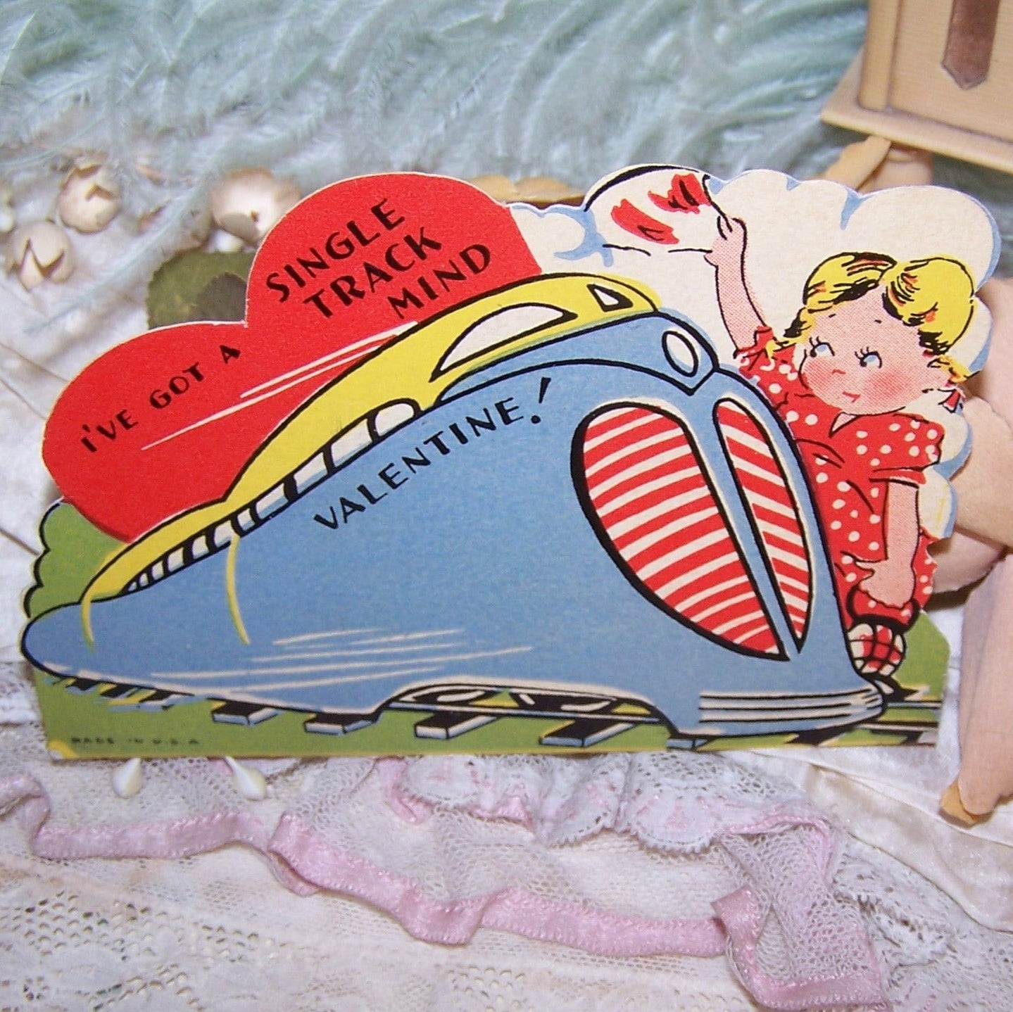 Used Art Deco era Valentines Day card. Depicting a Little Girl waving to a Streamliner Train, the sentiment is I'VE GOT A SINGLE TRACK MIND VALENTINE.