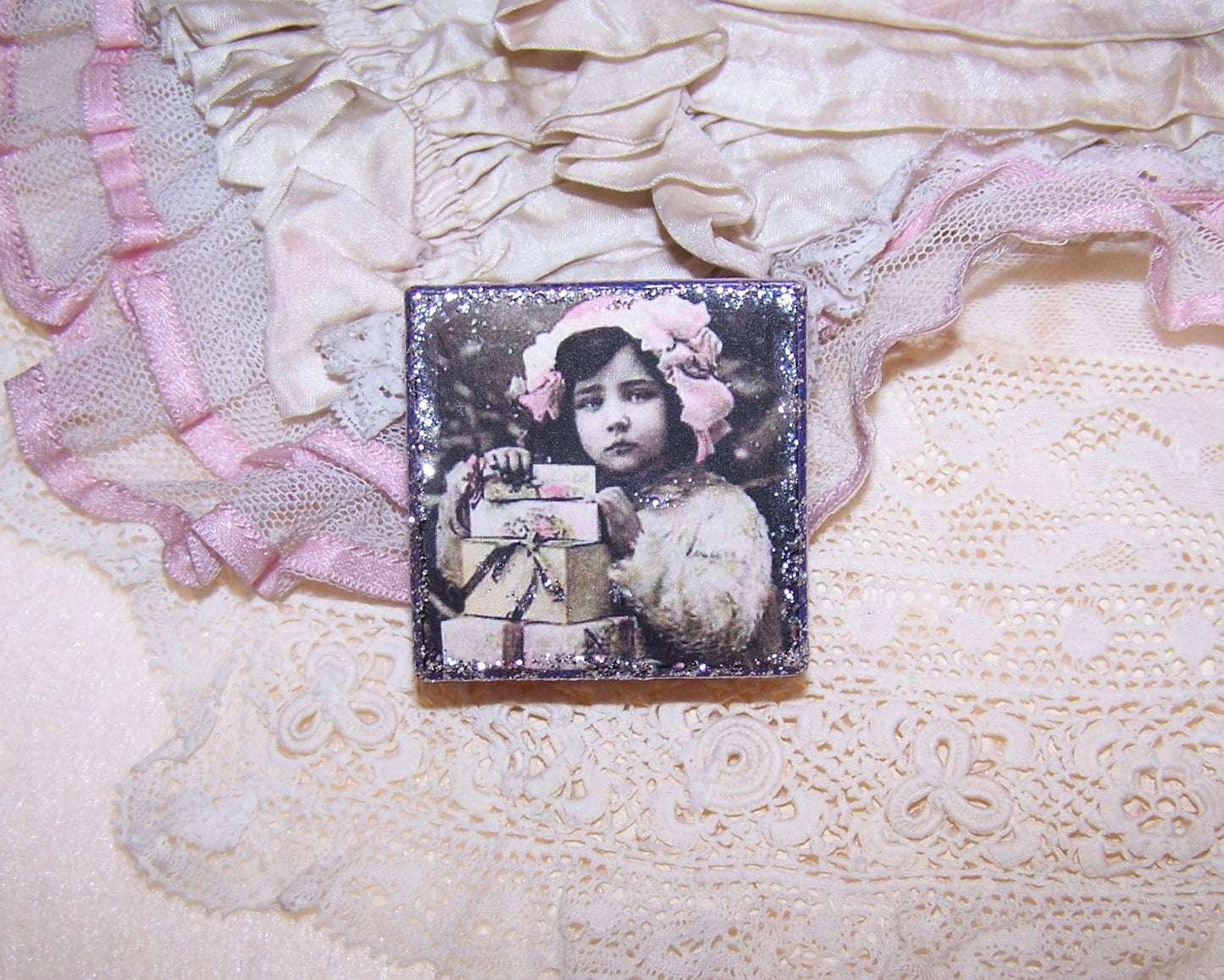 Antique French upcycled pharmacy box. The top displays the image of a young girl in pink holding onto a quartet of gifts. Perfect as a small gift box.