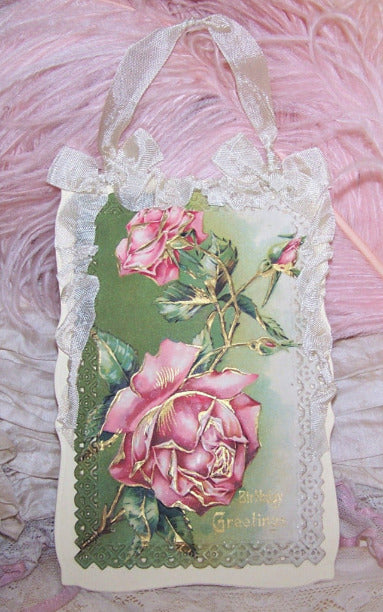 Repurposed Antique Postcard that displays pink roses along with the sentiment BIRTHDAY GREETINGS. Reverse is blank and has room to write your own message.