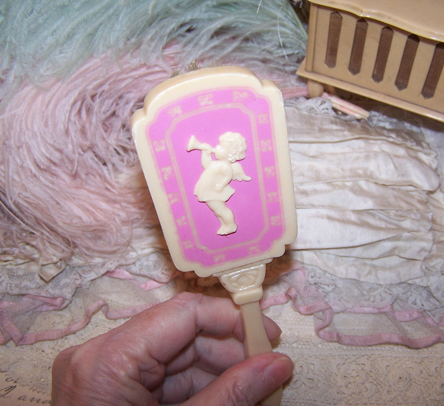 Vintage Pink/Cream Plastic Baby Brush - Cherub Blowing Trumpet