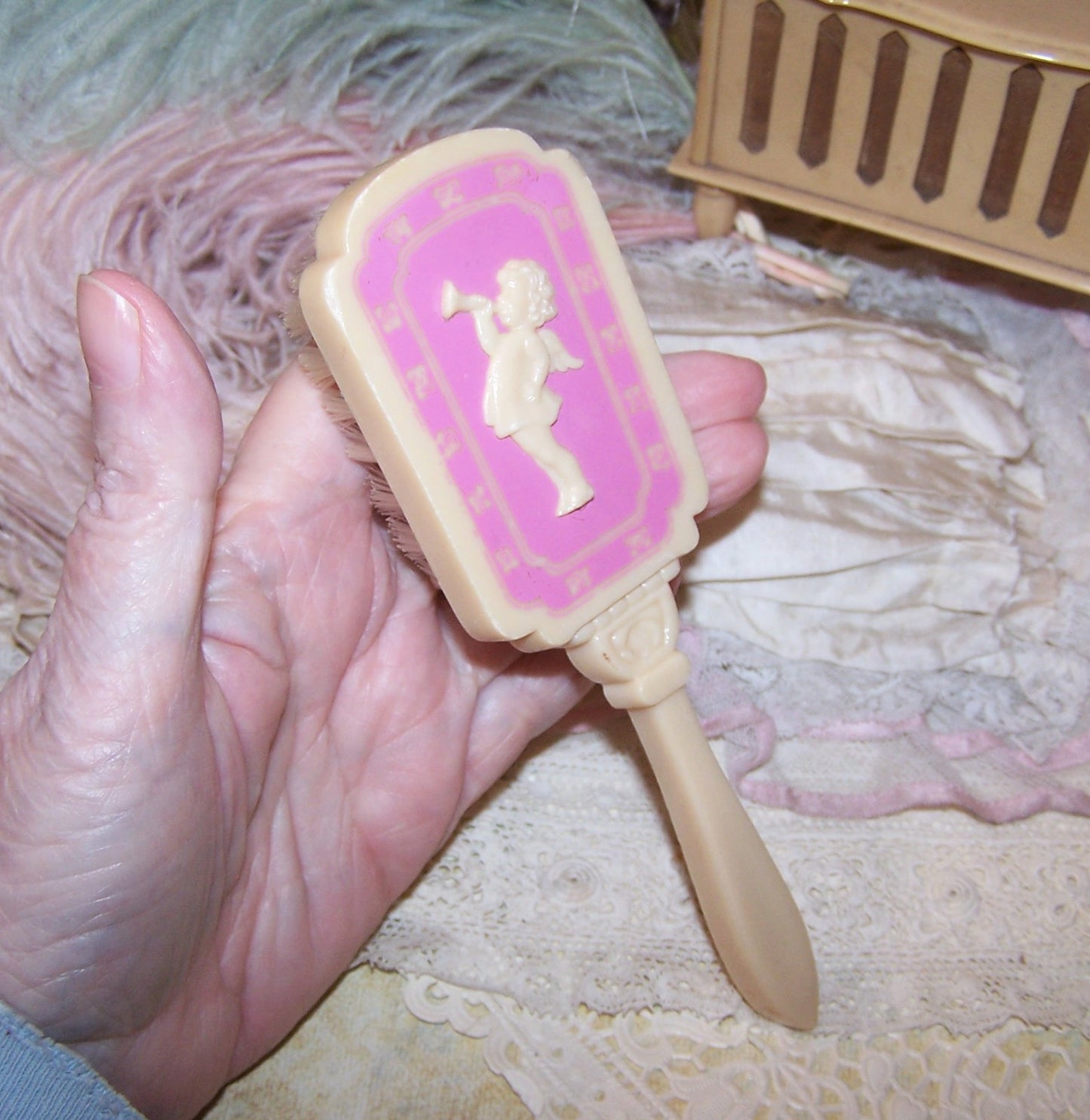Vintage Pink/Cream Plastic Baby Brush - Cherub Blowing Trumpet