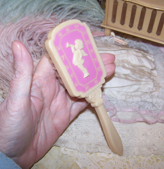 Vintage Pink/Cream Plastic Baby Brush - Cherub Blowing Trumpet