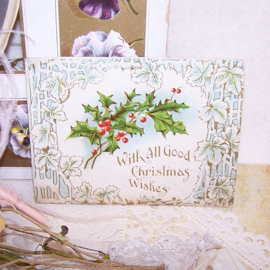 Unused, embossed Antique Victorian greeting card - With All Good Christmas Wishes. Lightly embossed front cover depicts a sprig of holly.  H M Burnside poem.
