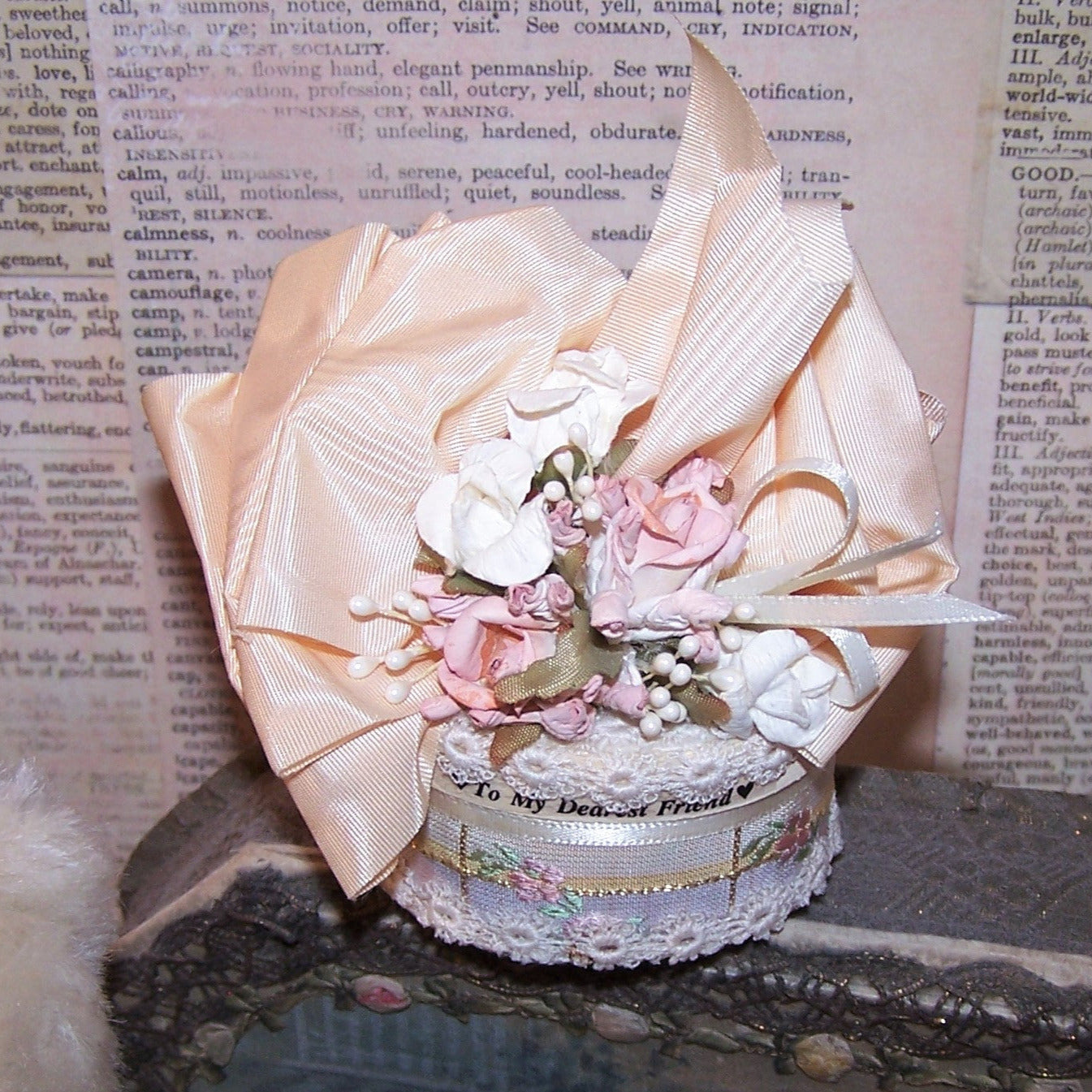 Victorian Revival oval chipwood trinket box decorated with ribbon and florals in tones of cream and mauve. Sentiment is TO MY DEAREST FRIEND.