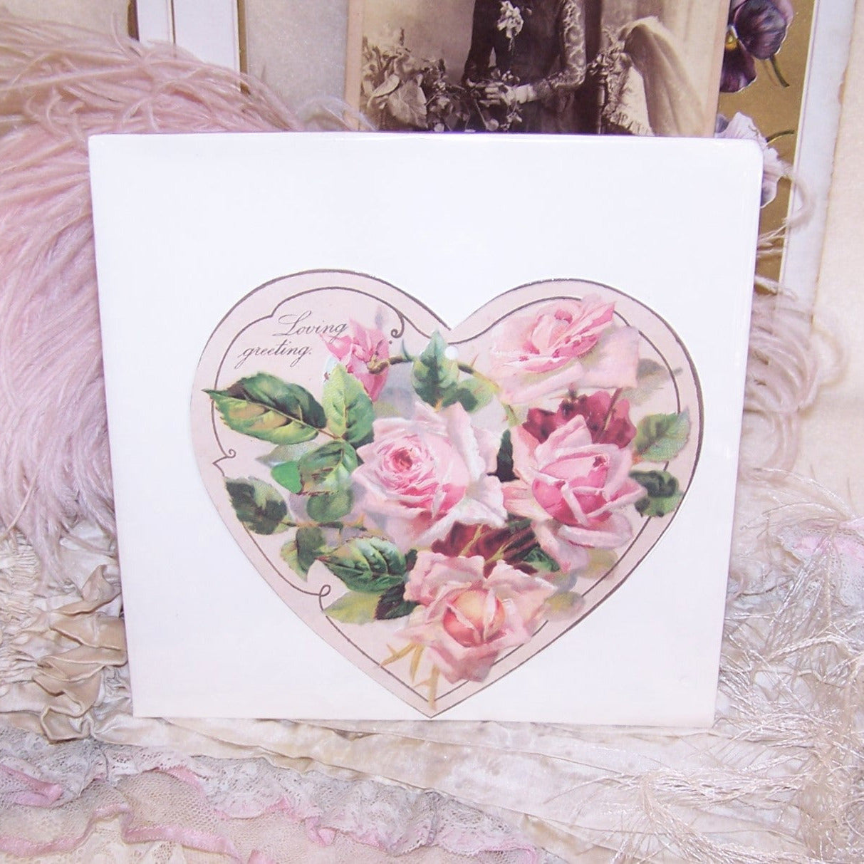 Winslow Papers C.1980 heart shaped die cut. Pink and Red Roses design with a sentiment that reads LOVING GREETING. Unopened in original envelope.