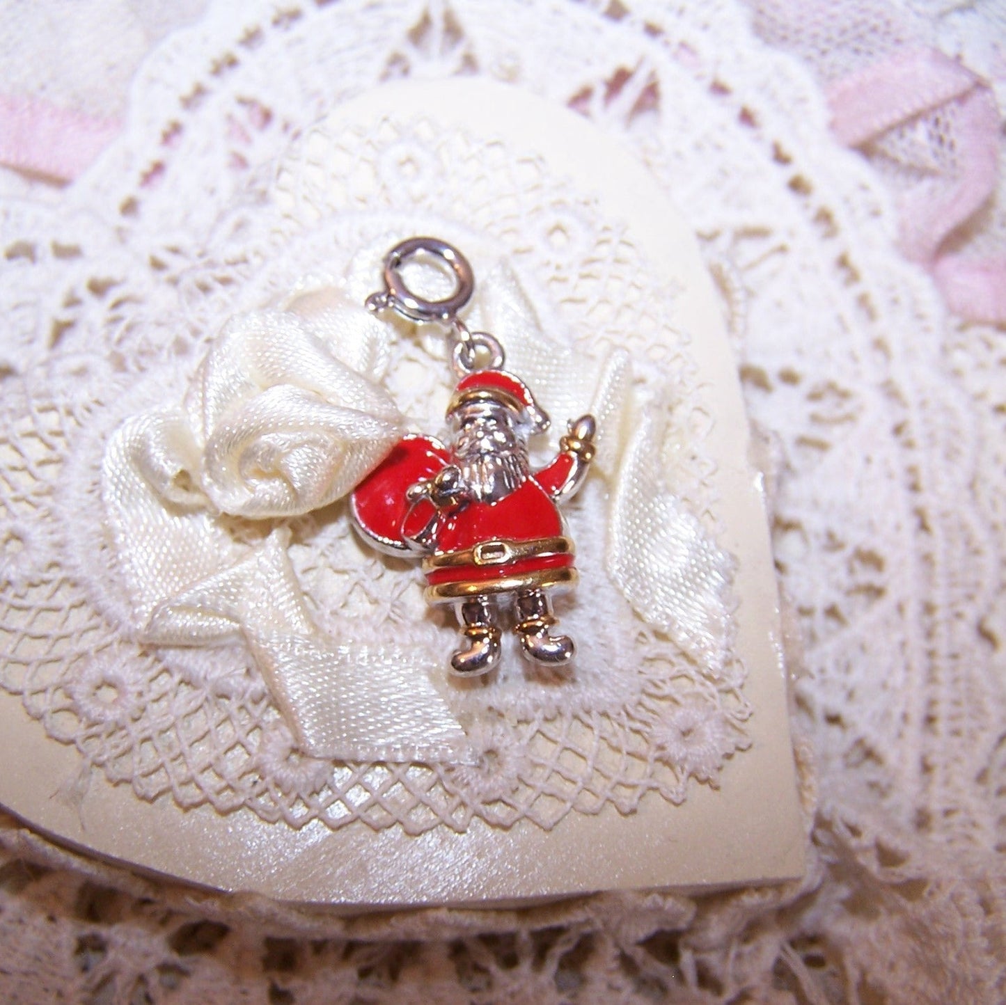 D'Joy Sterling Silver and cold enamel clip on charm of Santa Claus. Santa measures about 3/4" high and weighs 4.9 grams. Condition is very good.