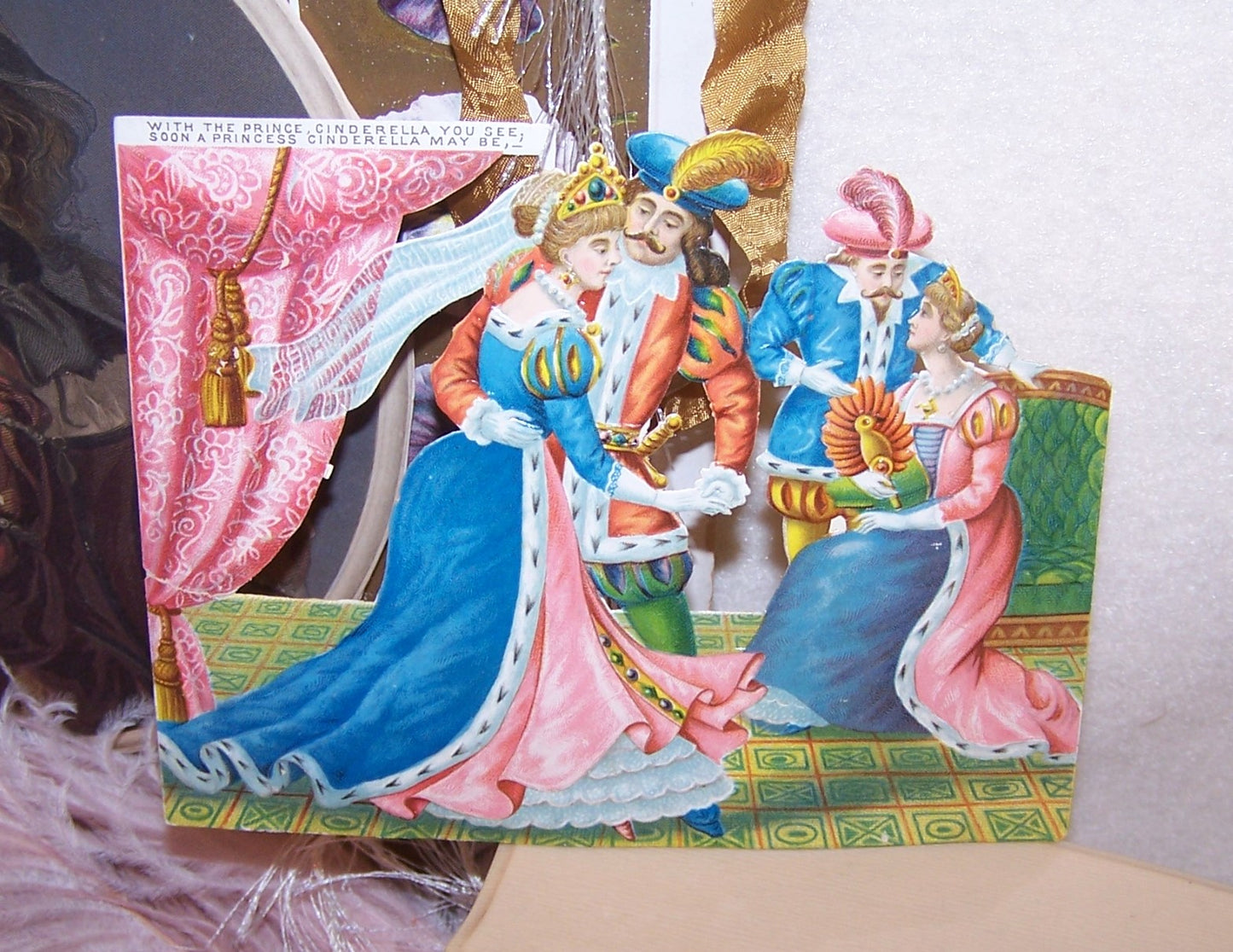 Antique Victorian 5-1/4" x 4-3/16" chromo die cut depicting Cinderella, her Prince and his parents. Condition is nice with paper residue to the back.