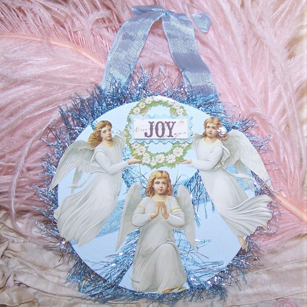 For the bride - JOY! One of a Kind, a paper gift tag that can double as an ornament. Lots of angels to the front and room for writing on the reverse.