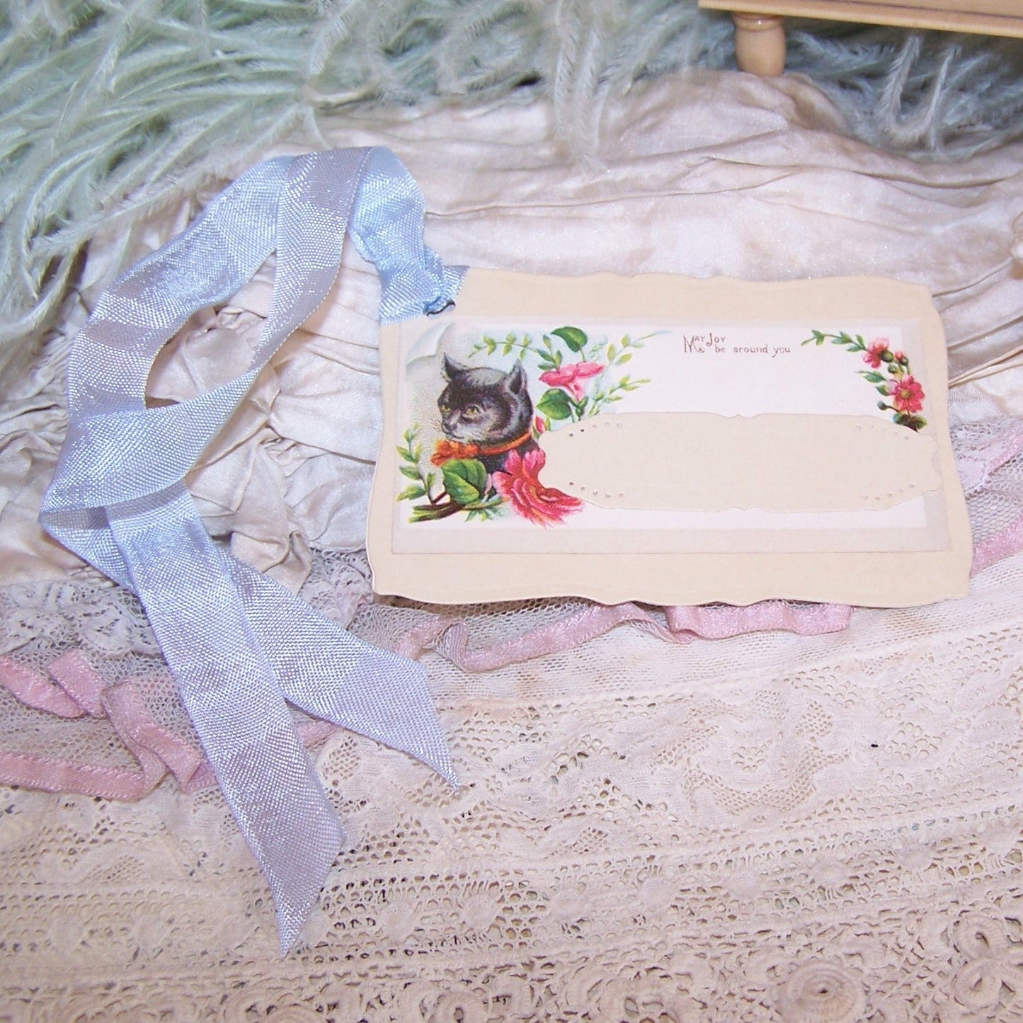 ONE OF A KIND handcrafted gift tag / paper ornament featuring a Cat and blue rayon ribbon. Sentiment is MAY JOY BE AROUND YOU. Can only be used once!