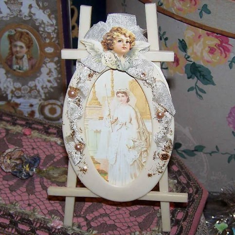 Here's a ONE OF A KIND upcycled celluloid picture frame from the 1930s. The frame is an easel style with an oval section for adding a picture or photo. There is no glass and the image slides in/out from the right side. Height is 6" - width at the widest part is 3-3/4".