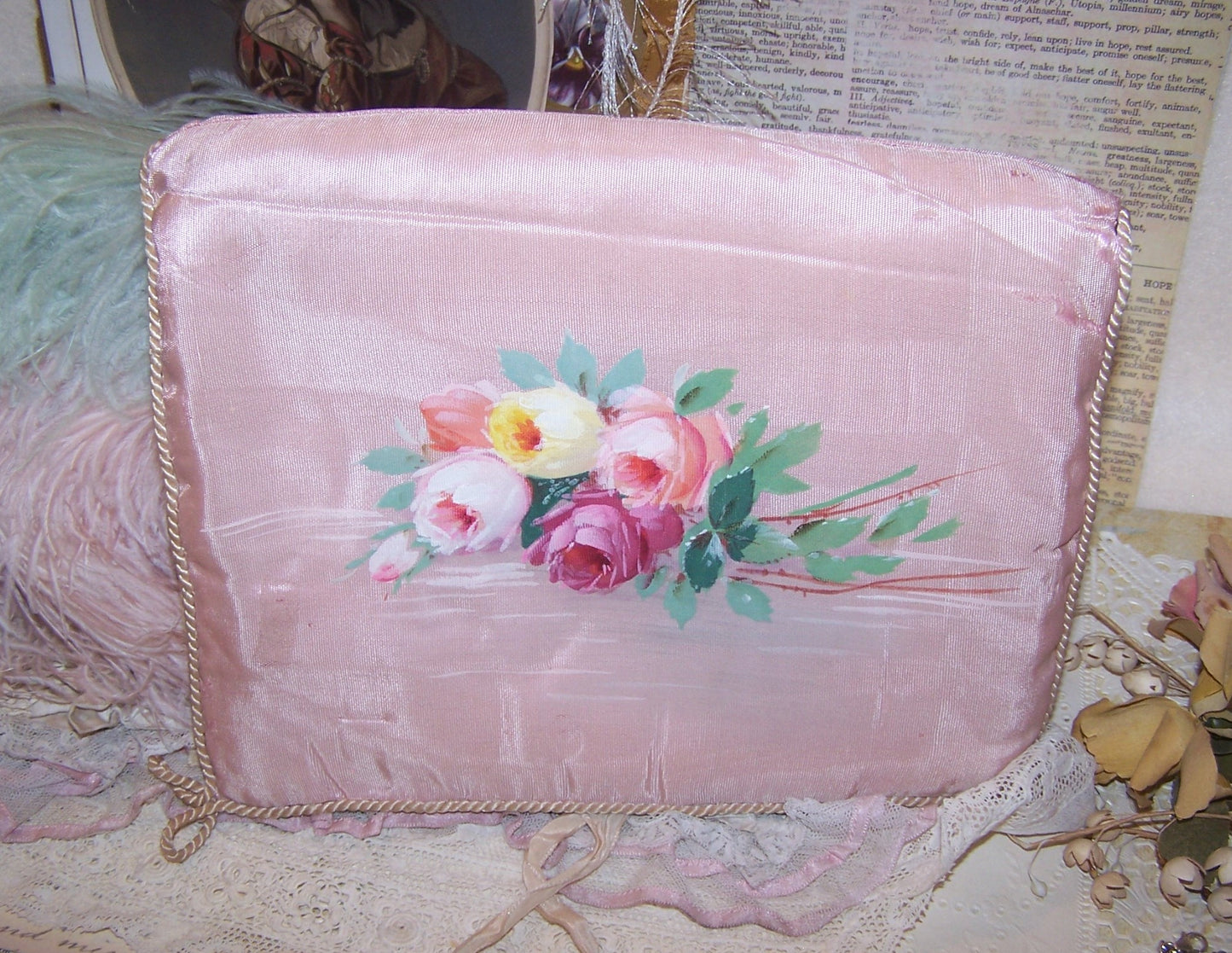 French handpainted moire hanky/lingerie holder. In a pale pink, the front design is of a bunch of roses. Silk interior. Needs TLC but displays beautifully.