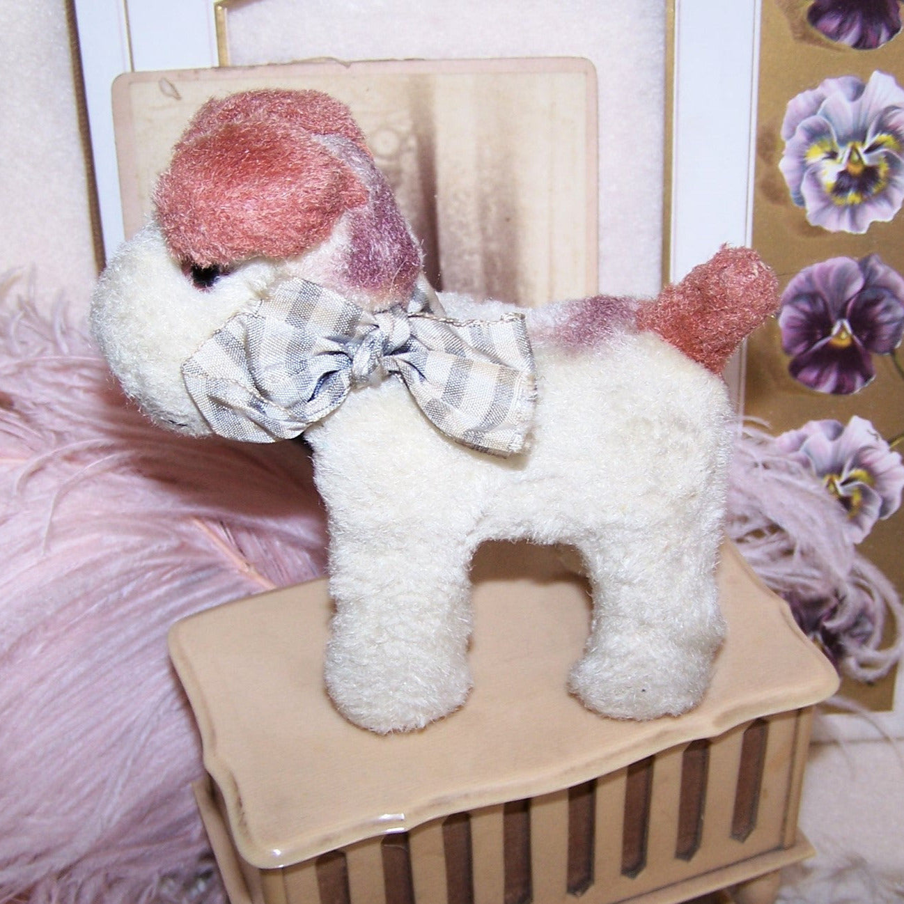 Vintage Made in Japan small plush toy of a small dog, a terrier I think. The rust brown & cream plush critter sports a grey/cream plaid fabric bow. Too cute!
