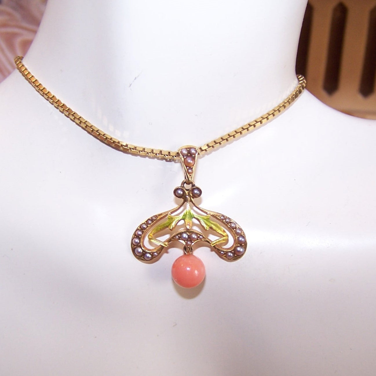 Antique Edwardian 14K Gold, enamel, natural pearl and coral pendant / lavaliere crafted by Krementz. Button stud hallmark. 1" long x 7/8" wide. 2.1 grams.