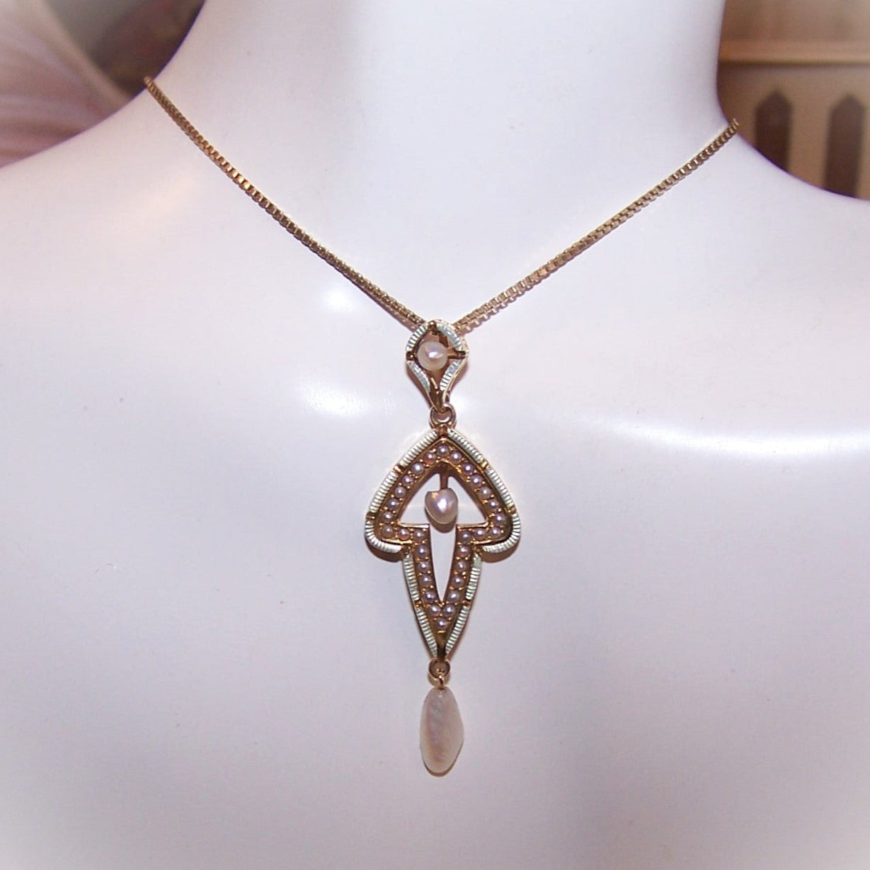 Antique Edwardian 14K Gold, enamel and natural pearl pendant / lavaliere crafted by Krementz. Button stud hallmark. 1-11/16" long - width is 9/16". 2.7 grams.