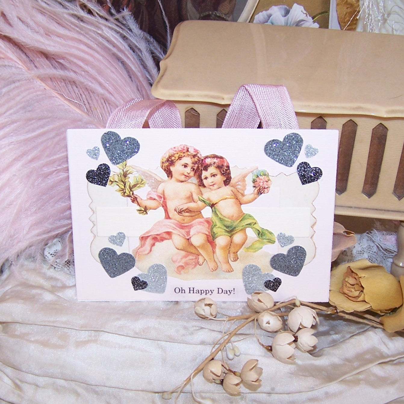 Oh Happy Day! OOAK handcrafted mixed media holiday ornament with cupid - putti - cherub graphics. Size is 6" x 3" approx. For any occasion!