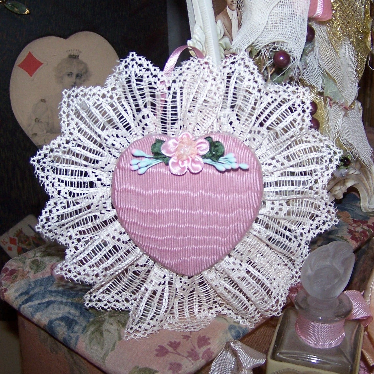 Puffy heart fabric ornament of moire taffeta and lace. Embellished with a handsewn French Revival ribbon applique. Size is 4-1/2" high/wide. One of a Kind.