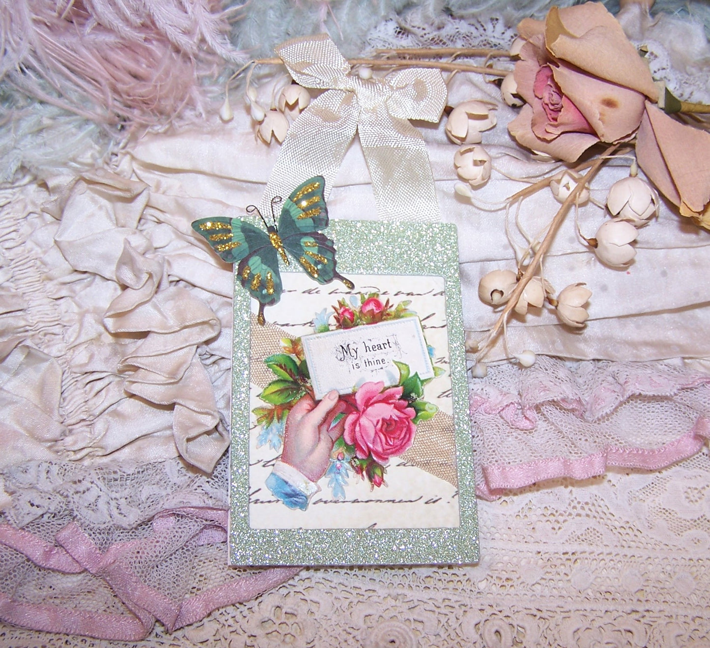 OOAK handcrafted ornament for Valentine's Day or any other occasion where the sentiment is MY HEART IS THINE. Victorian die cut of hand holds Pink Roses.