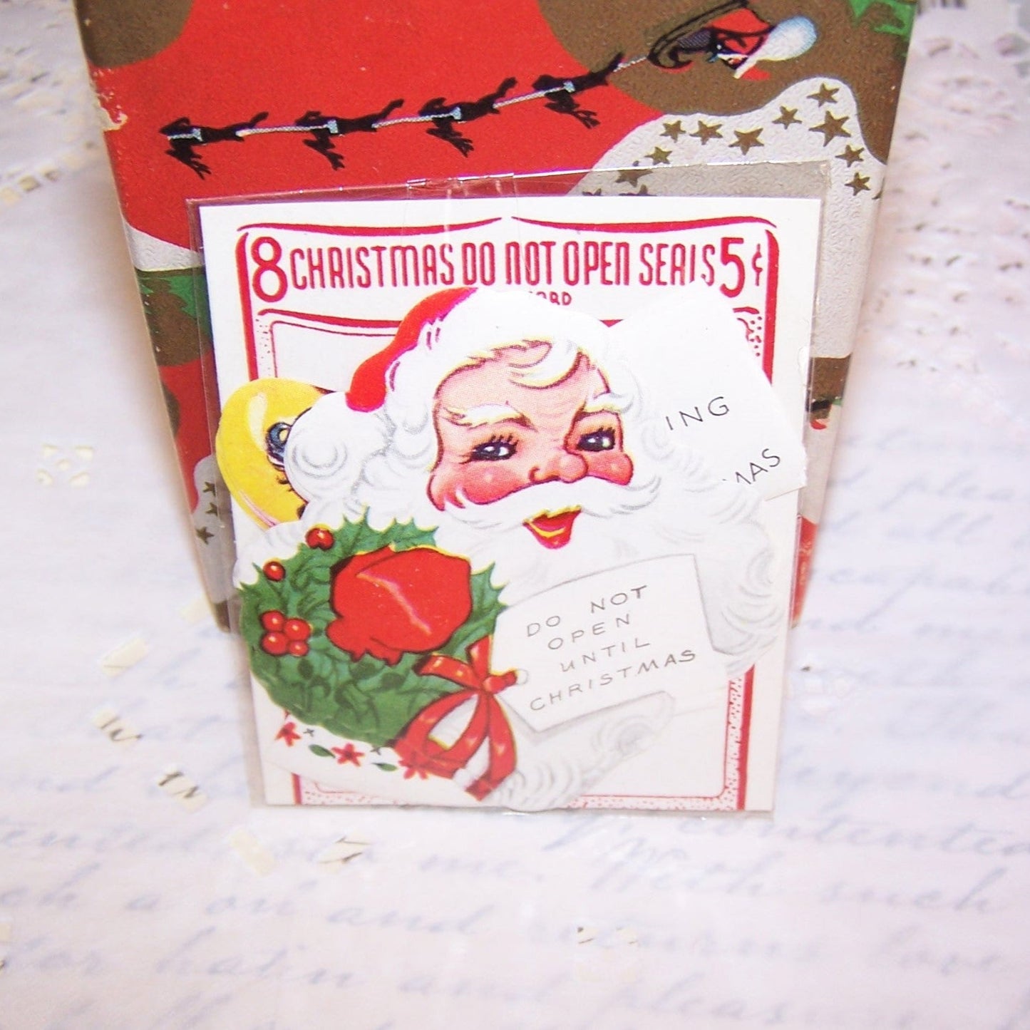 8 Christmas stickers in original pack - 4 Santa Claus & 4 young girl. Phrases are DO NOT OPEN UNTIL CHRISTMAS and NO PEEKING TILL CHRISTMAS. 3" x 2-1/2" approx