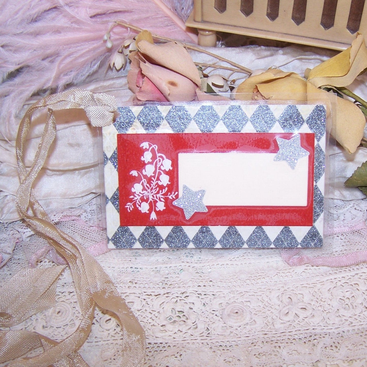 Antique Victorian Revival mixed media re-useable gift tag - package tie. Cardstock is overlaid with a calling card displaying Lily of the Valley graphics.