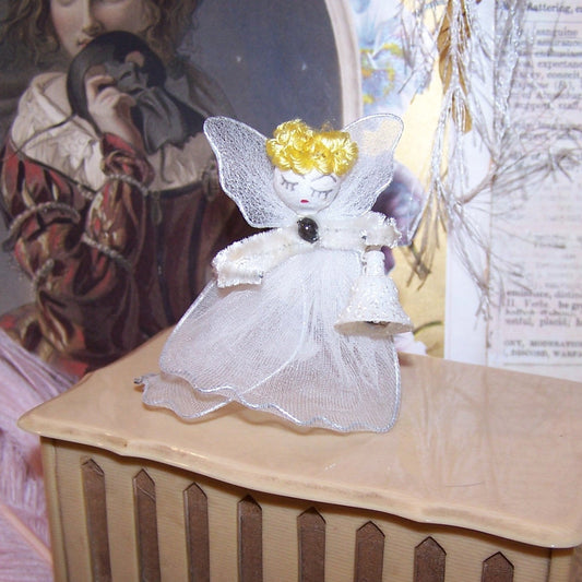 Vintage Made in Japan Christmas ornament - an angel. With blonde hair, spun cotton face, chenille arms and gauze dress, height is 2-1/4" high x 2" wide.