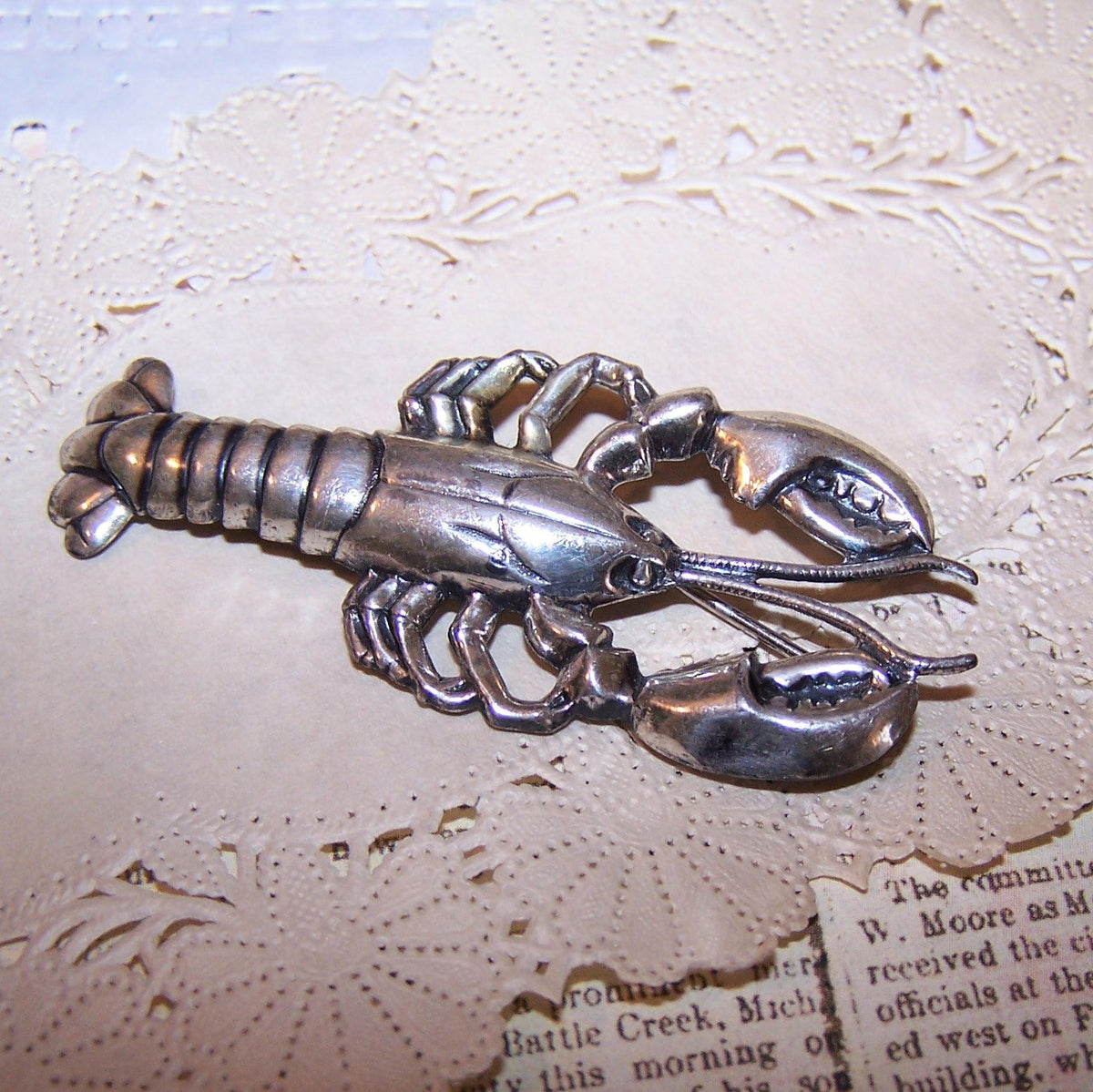 1960s Sterling Silver pin/brooch by Beau in the shape of a lobster.  Good strike to the design. Length is 2-1/4". Vintage patina to the silver.
