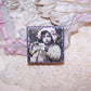 Antique French upcycled pharmacy box. The top displays the image of a young girl in pink holding onto a quartet of gifts. Perfect as a small gift box.