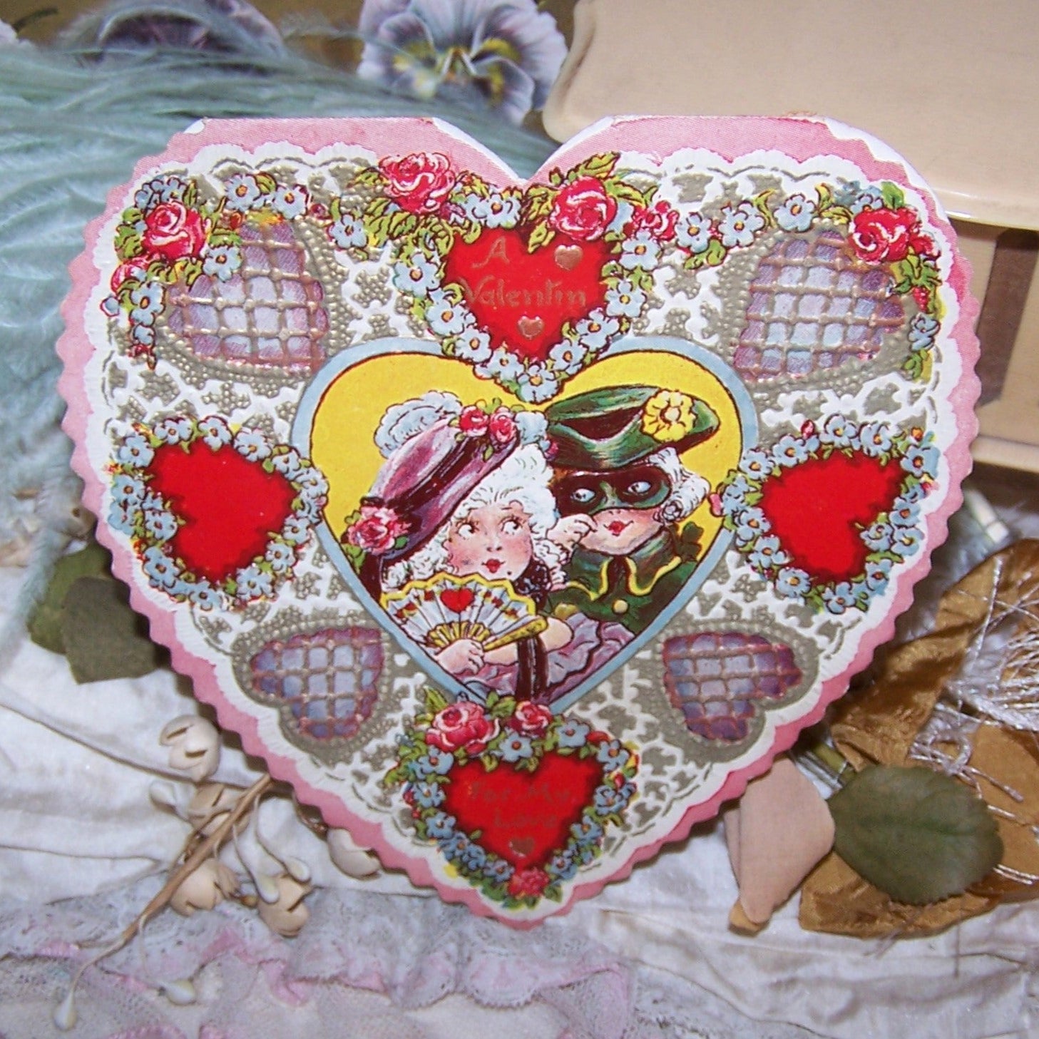 For repurposing, a USED Art Deco Valentine with a pair of children dressed as a Highwayman and a Lady. The inside has a small poem about the couple.  