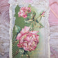 Repurposed Antique Postcard that displays pink roses along with the sentiment BIRTHDAY GREETINGS. Reverse is blank and has room to write your own message. 