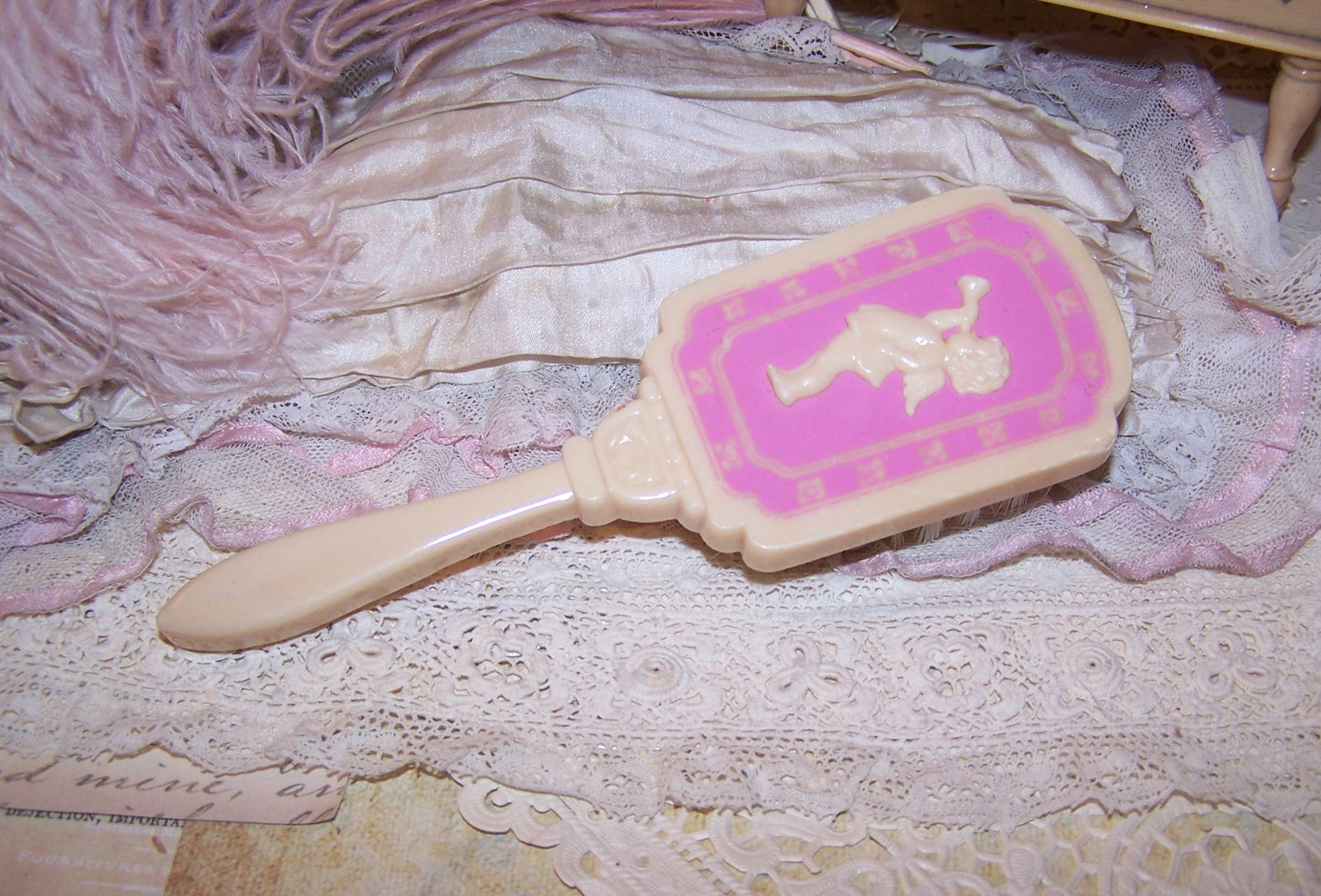 Vintage Pink/Cream Plastic Baby Brush - Cherub Blowing Trumpet
