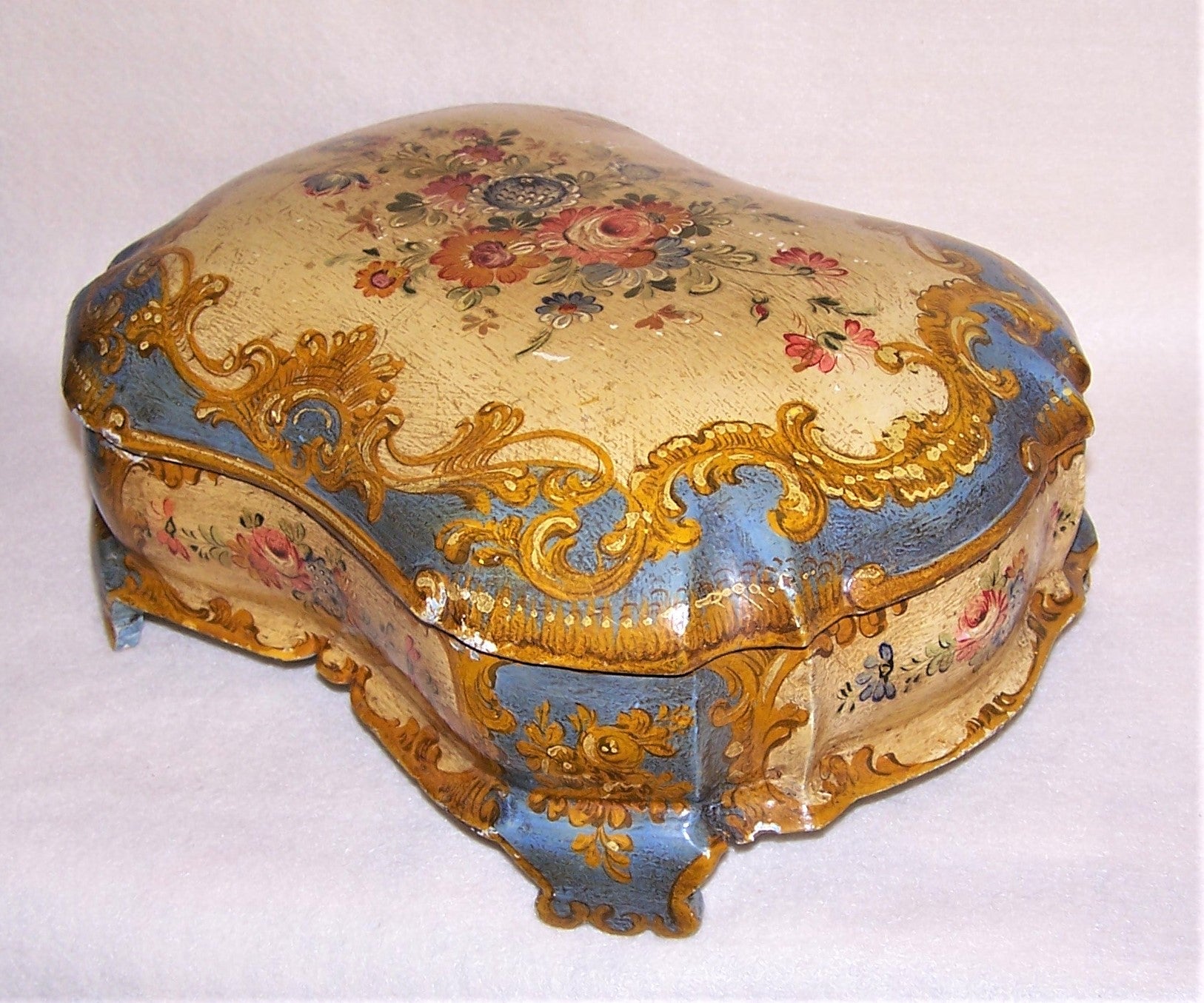 Large Italian Tole handpainted tabletop box.  Made of wood and painted in oils, the design is Shabby Chic floral.  Buttercream and French Blue coloring.  