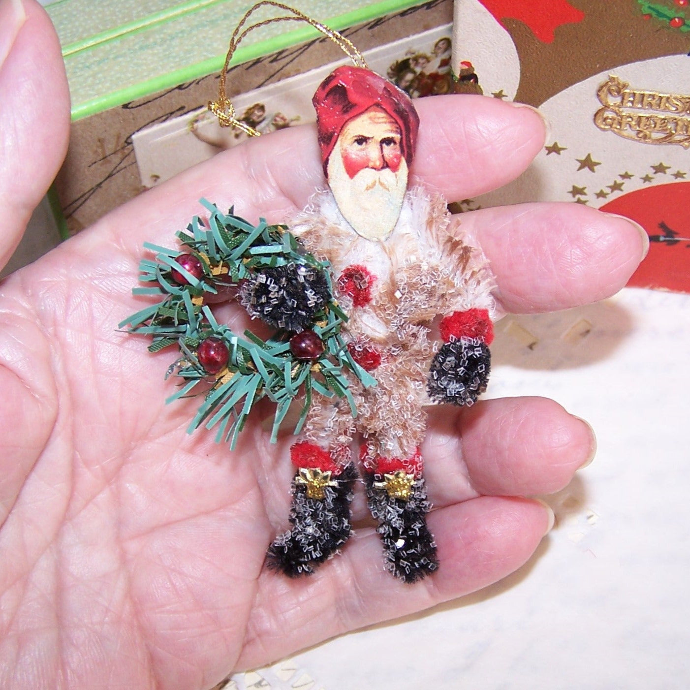 Glittered Chenille Santa Claus Carrying Wreath Christmas Ornament