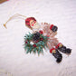 Glittered Chenille Santa Claus Carrying Wreath Christmas Ornament