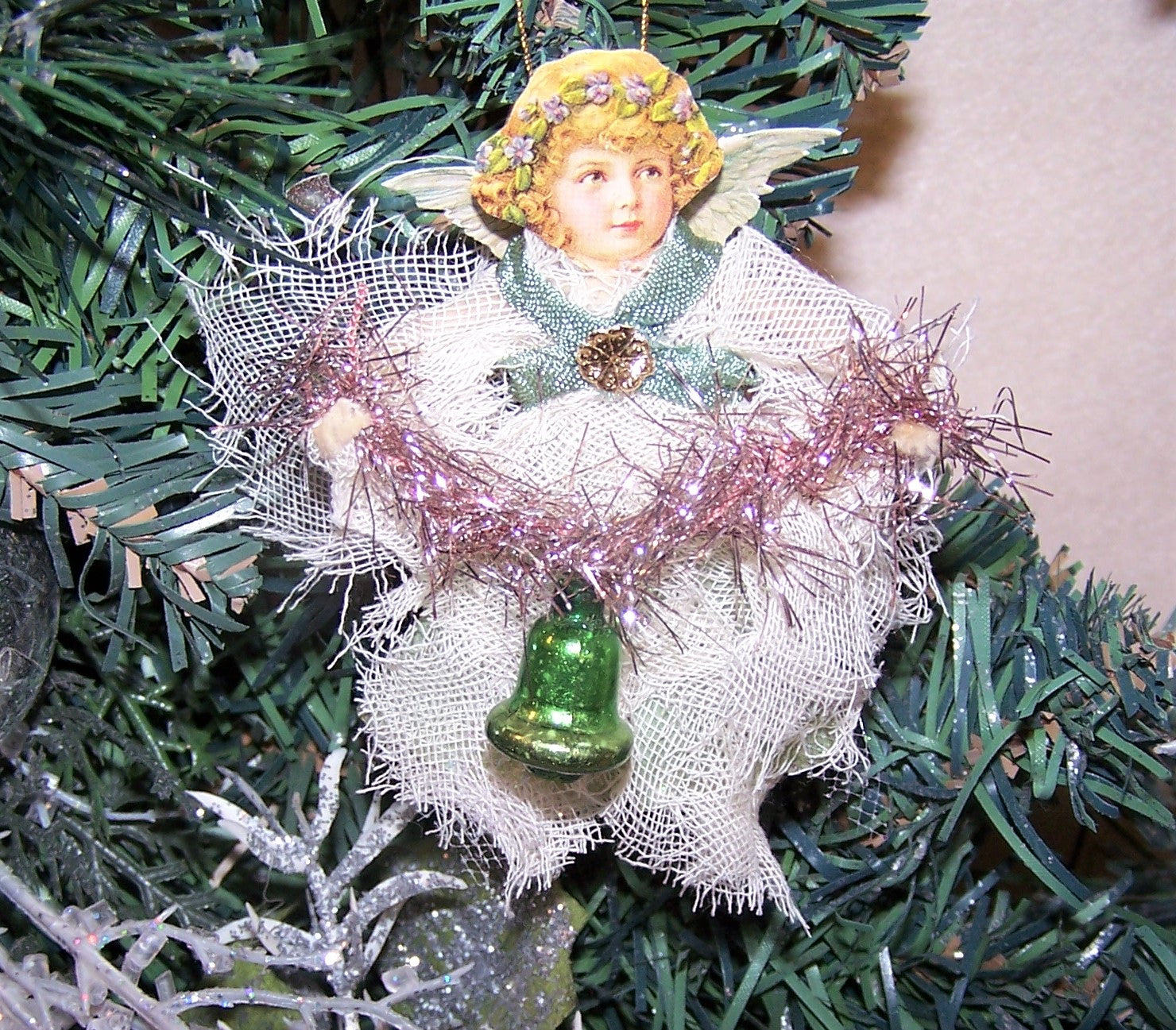 Of mixed materials, here's a small ALL OCCASION Guardian Angel decoration. The girl holds a pink tinsel garland from which a glass bell hangs.  One of a Kind!