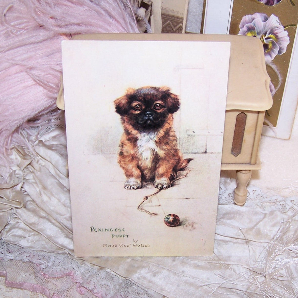 Early 1900s Raphael Tuck & Sons OILETTE postcard of a Pekingese Puppy by Maud West Watson. 