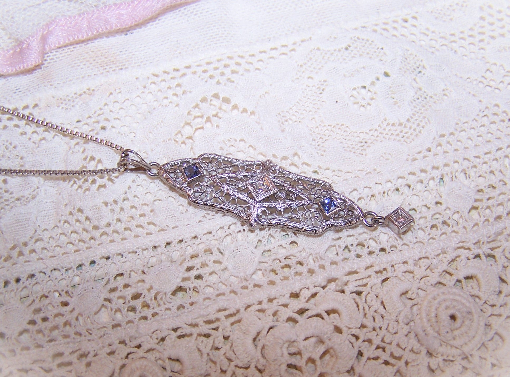 Antique Edwardian 14K White Gold filigree lavaliere pendant with 2 faceted round diamonds and 2 princess cut blue zircons or sapphires. 1-7/8" long x 7/16". 
