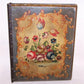 A bit of 1960s Italian Tole in the form of a looseleaf binder - ring binder.  Handpainted covers with a plethora of flowers and leaves.  Brocade interior. 