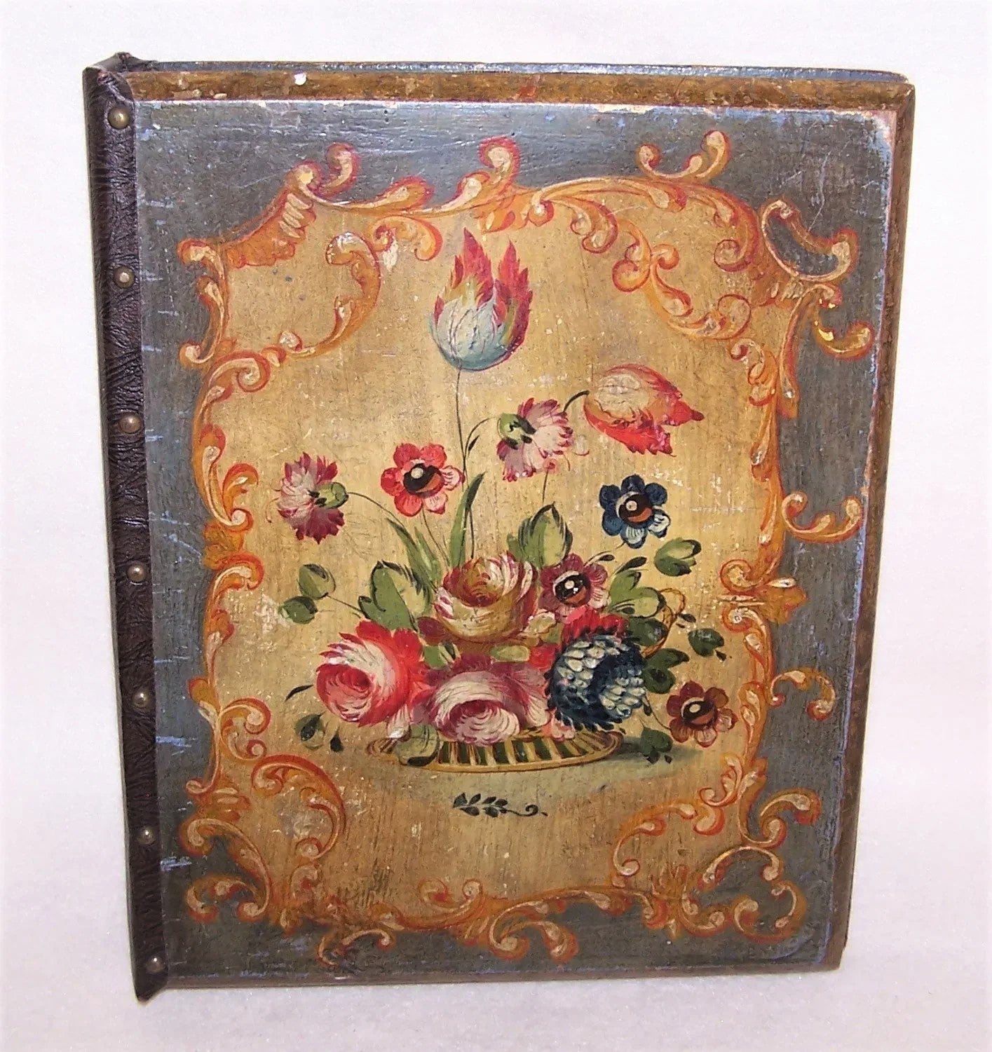 A bit of 1960s Italian Tole in the form of a looseleaf binder - ring binder.  Handpainted covers with a plethora of flowers and leaves.  Brocade interior. 