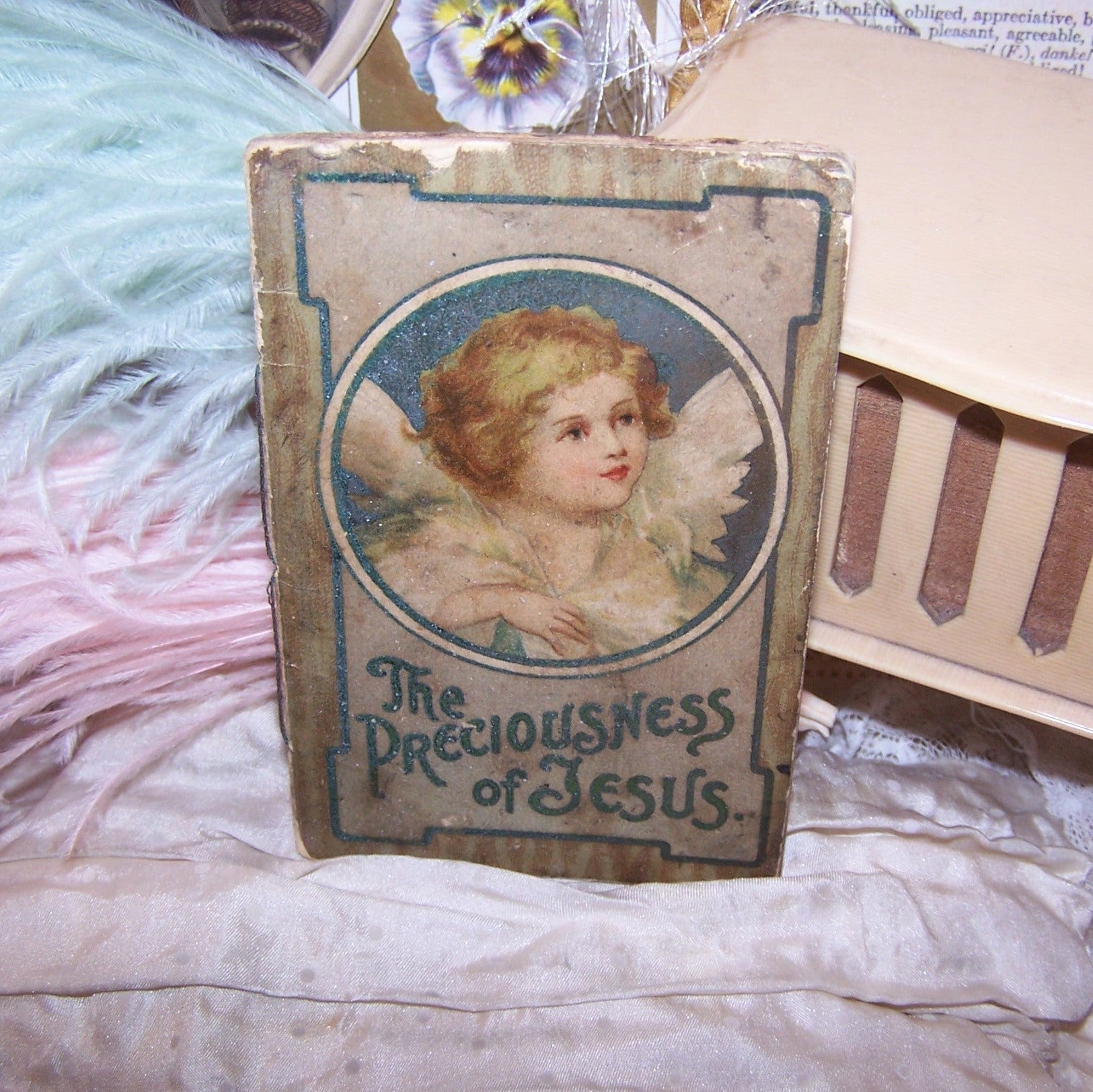 An antique booklet, printed in English and entitled "The Preciousness of Jesus".  Shabby appearance but the graphics are wonderful. Size is 4" x 2-1/2" approx. 