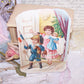 A holiday Victorian die cut that depicts children exiting a room with their new toys that were placed under the Christmas Tree.  5-1/2" x 3-3/4" approx. 