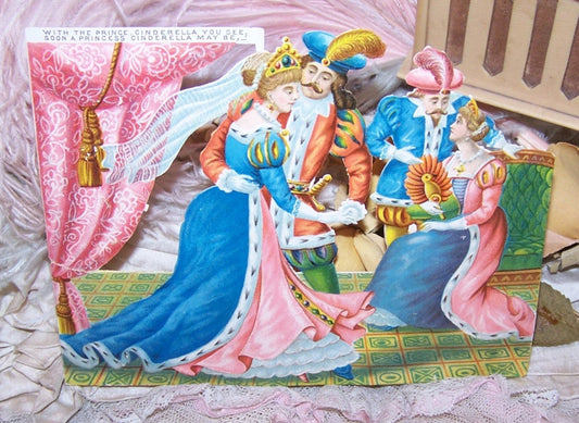 Antique Victorian 5-1/4" x 4-3/16" chromo die cut depicting Cinderella, her Prince and his parents. Condition is nice with paper residue to the back. 