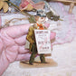 Dating to the late 1890s or so, here's a pristine Antique Victorian die cut - a man carrying a sandwich board advertising a play at the Drury Lane Theatre, London England.  Size of the piece is 4-3/4" x 3" approx.  Again, pristine - no paper loss, breaks, discoloration, etc.