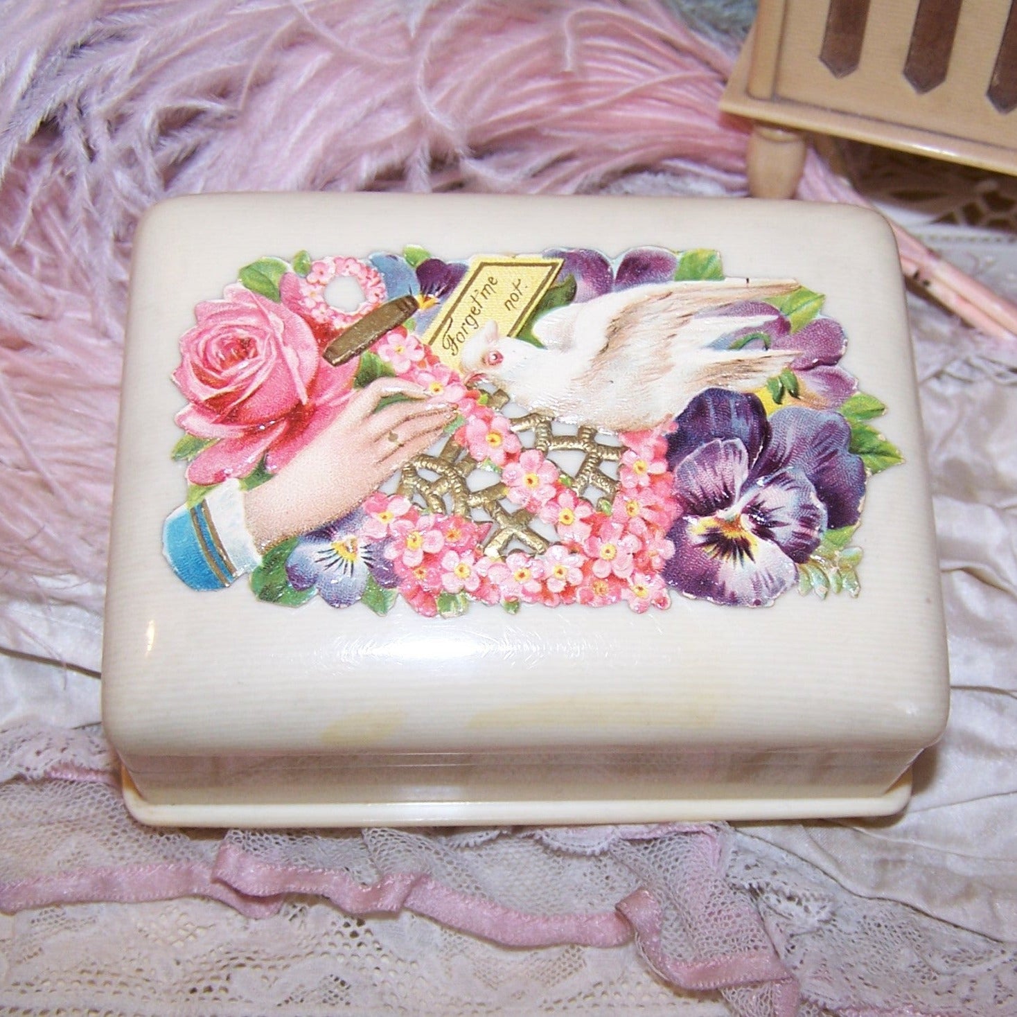 Art Deco celluloid jewelry box! Inside reveals purple velvet inside with recessed area for chains, right side has 3 slots for rings. 4" x 3" with 1-3/4" height.   