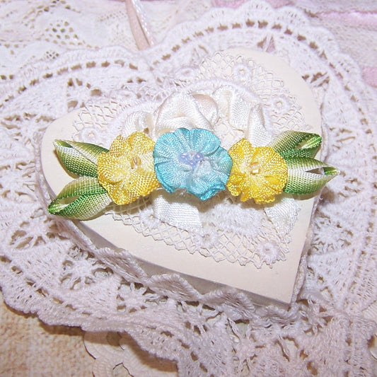 Art Deco French ombre ribbonwork floral spray in colors of yellow / turquoise blue; the centers hold glass beads. End leaves are lime green. 2-1/4" x 5/8". 