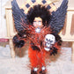 A mixed media OOAK "Dark Angel" Halloween ornament. My Black/Orange little girl stands guard with skull in hand.  A cute holiday accent for any area.  