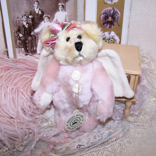 Handmade in China for Boyds Bears aka The Boyds Collection, here's a cream/pink plush angel bear with velour wings.&nbsp; The bear can be posed and has a height of 6".&nbsp; Excellent unused condition - it is straight out of the original plastic bag from Boyds (and yes, I have had the bag for a VERY long time).&nbsp; Leave as is and display or repurpose into another design.&nbsp; From a smoke free, pet free home.