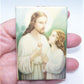 Made in USA celluloid religious easel image depicting Jesus Christ and a young child. The image is done in hushed pastel tones. 3-1/8" x 2-1/8".