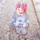 Handmade chenille ornament designed in a Victorian Revival manner.  A tabby cat carries a sign reading JOY.  One of a Kind decoration for Spring. 